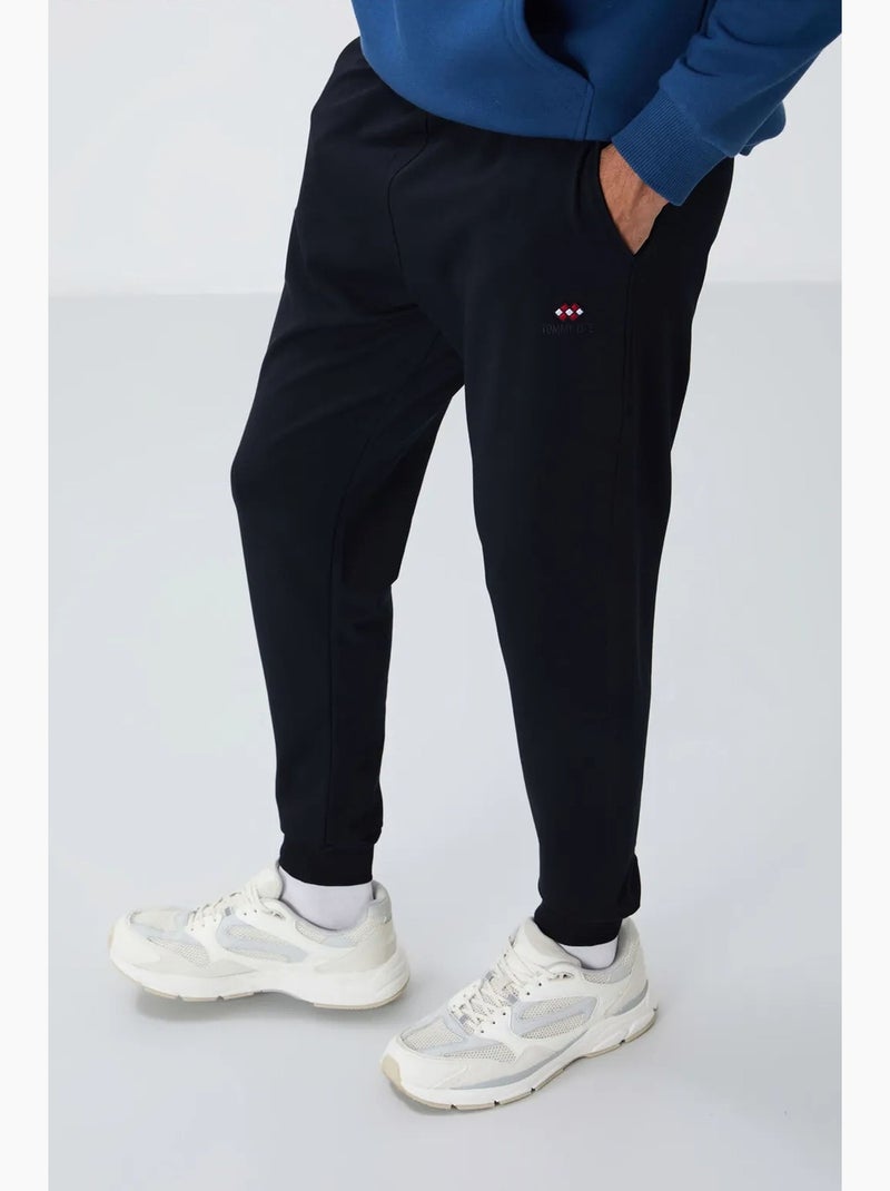 Pantalon de jogging homme en molton uni tommy Bleu lagon - Kiabi
