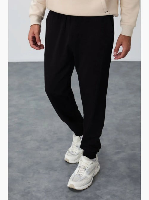 Pantalon de jogging homme en molton uni tommy - Kiabi