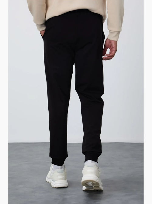 Pantalon de jogging homme en molton uni tommy - Kiabi