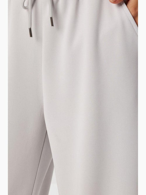 Pantalon de jogging jambe large à taille à cordon istanbul - Kiabi Pantalon de jogging jambe large à taille à cordon istanbul - Kiabi