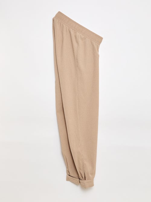 Pantalon de jogging pour femme en maille légère à taille élastiquée - Kiabi Pantalon de jogging pour femme en maille légère à taille élastiquée - Kiabi