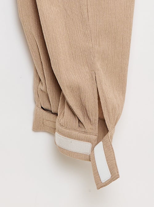 Pantalon de jogging pour femme en maille légère à taille élastiquée - Kiabi Pantalon de jogging pour femme en maille légère à taille élastiquée - Kiabi