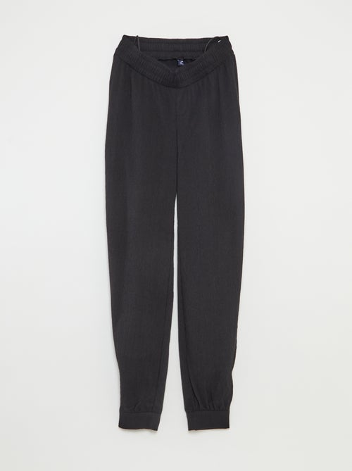 Pantalon de jogging pour femme en maille légère à taille élastiquée - Kiabi Pantalon de jogging pour femme en maille légère à taille élastiquée - Kiabi