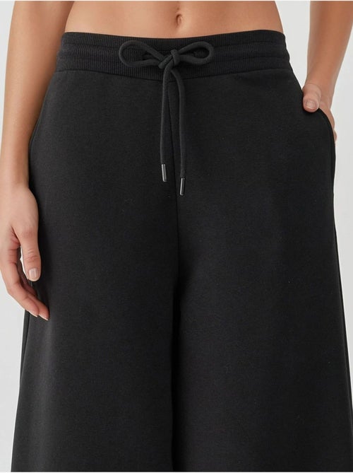 Pantalon de survêtement basique à coupe ajustée et surélevée hiccup - Kiabi Pantalon de survêtement basique à coupe ajustée et surélevée hiccup - Kiabi