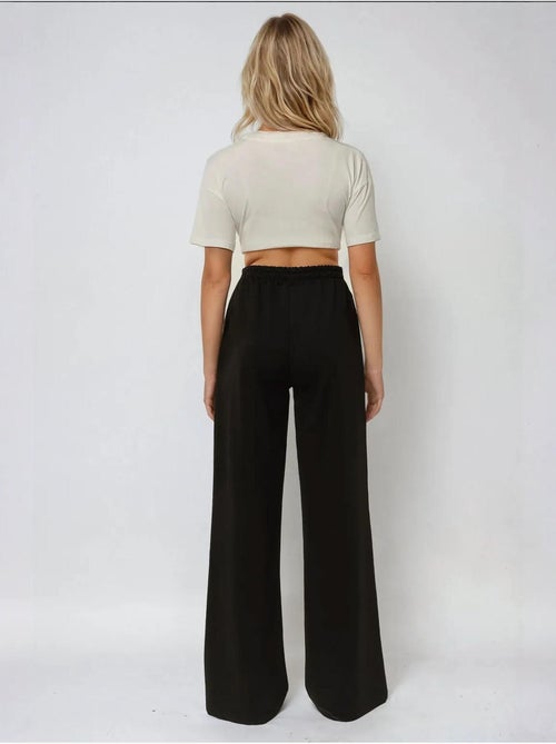 Pantalon de survêtement élastique à jambes larges hiccup - Kiabi Pantalon de survêtement élastique à jambes larges hiccup - Kiabi