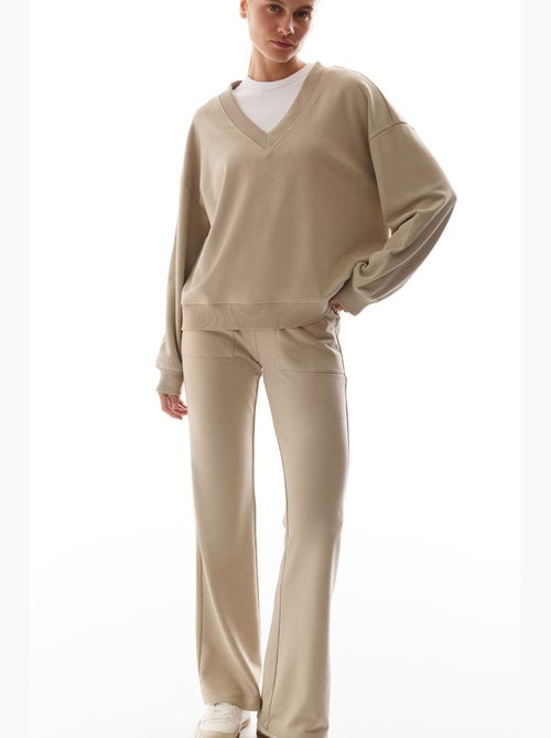 Pantalon de survêtement évasé avec détail côtelé penti - Kiabi Pantalon de survêtement évasé avec détail côtelé penti - Kiabi