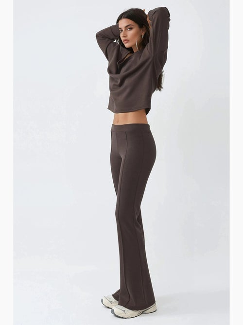 Pantalon évasé taille haute avec ceinture élastique busem - Kiabi Pantalon évasé taille haute avec ceinture élastique busem - Kiabi