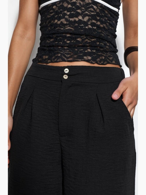 Pantalon femme taille haute à jambe large busem - Kiabi Pantalon femme taille haute à jambe large busem - Kiabi