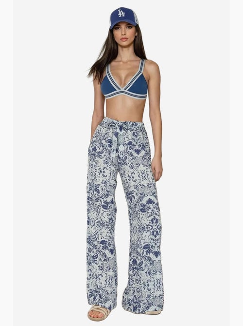 Pantalon imprimé à taille élastique et jambes larges hiccup - Kiabi Pantalon imprimé à taille élastique et jambes larges hiccup - Kiabi