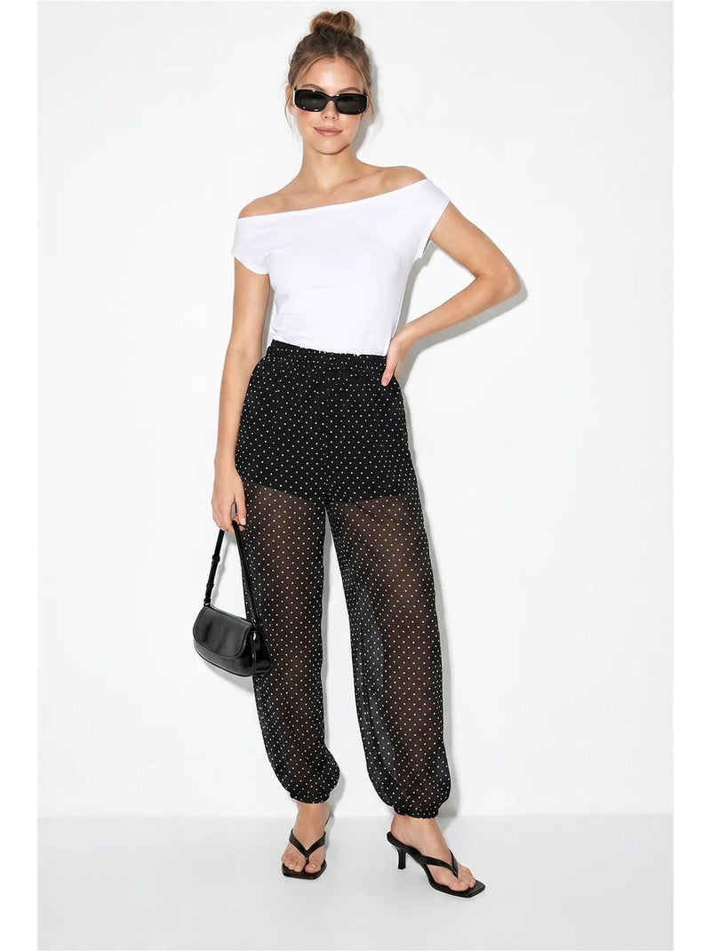 Pantalon jogger en mousseline à pois lucci Noir - Kiabi