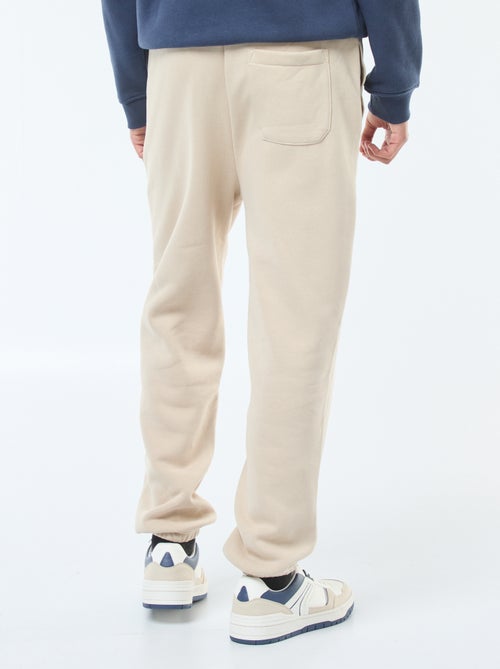 Pantalon jogging uni avec cordons de serrage à la taille - Kiabi Pantalon jogging uni avec cordons de serrage à la taille - Kiabi
