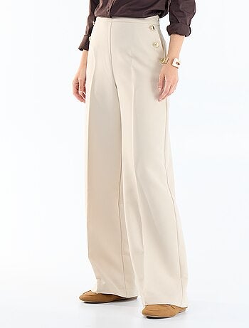 Pantalon large avec boutons dorés fantaisies sur les poches