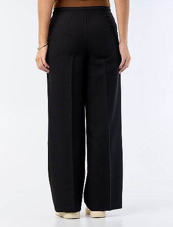 Pantalon large avec boutons dorés fantaisies sur les poches