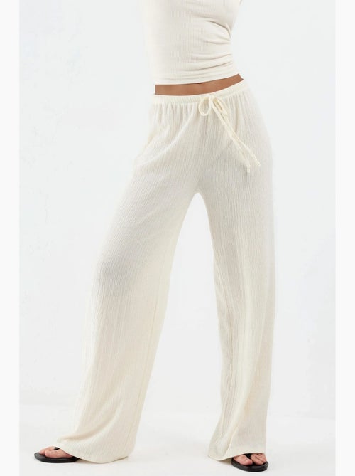 Pantalon large avec cordon de serrage à la taille busem - Kiabi Pantalon large avec cordon de serrage à la taille busem - Kiabi