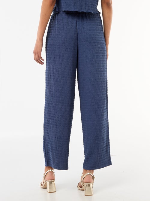 Pantalon large en maille smockée - Kiabi