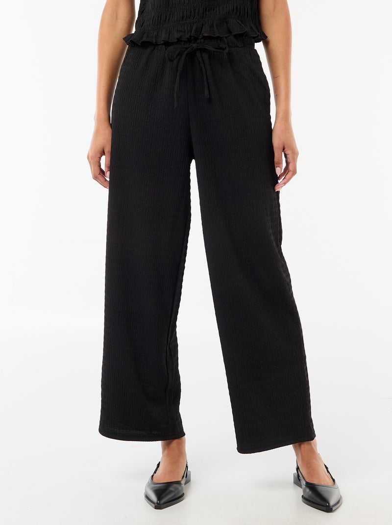 Pantalon large en maille smockée Noir - Kiabi