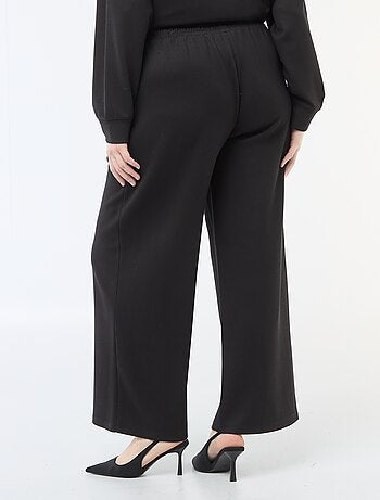 Pantalon large en matière stretch côtelée