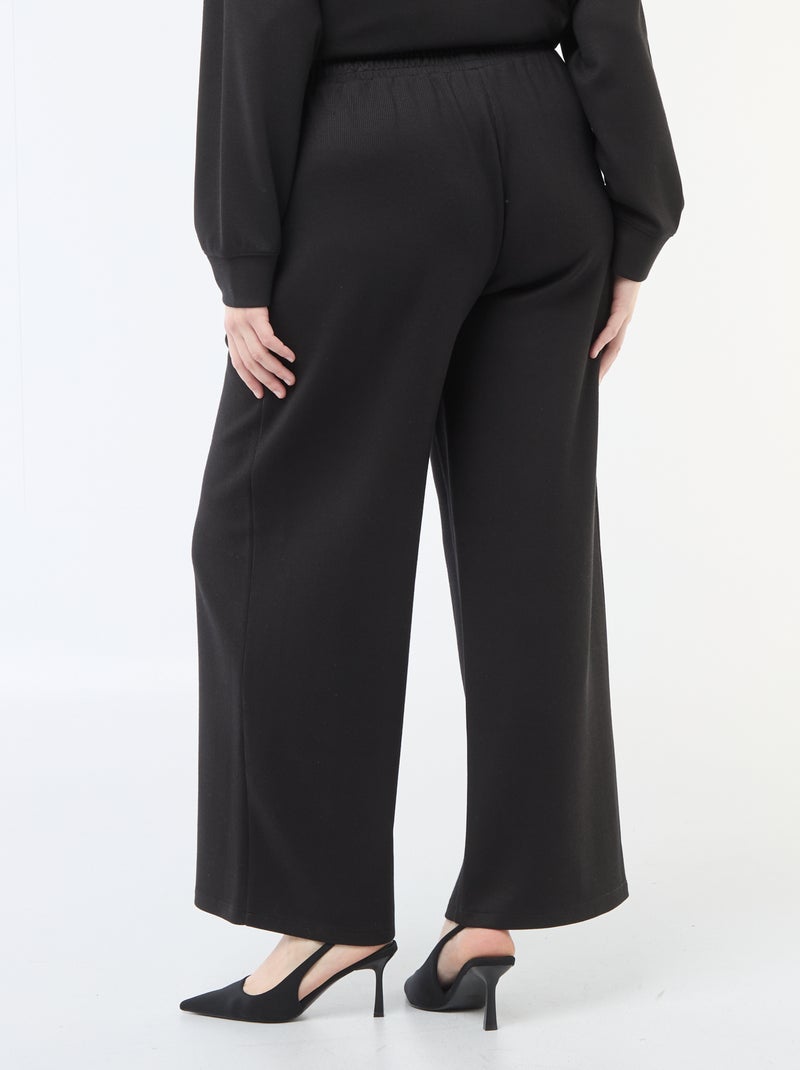 Pantalon large en matière stretch côtelée Noir - Kiabi