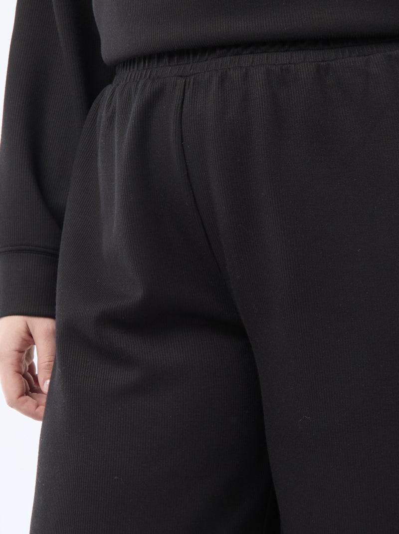 Pantalon large en matière stretch côtelée Noir - Kiabi