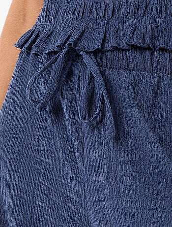 Pantalon large ne maille smockée