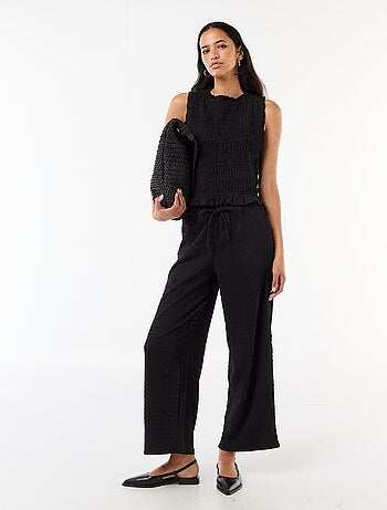 Pantalon large ne maille smockée
