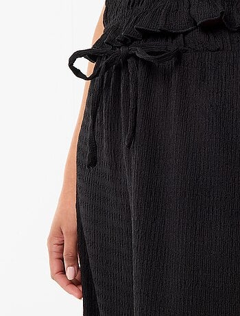 Pantalon large ne maille smockée