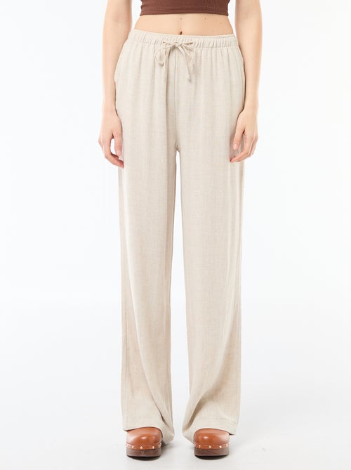 Pantalon large pour femme à taille élastiquée - Kiabi Pantalon large pour femme à taille élastiquée - Kiabi