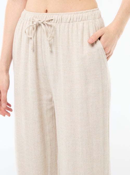 Pantalon large pour femme à taille élastiquée - Kiabi Pantalon large pour femme à taille élastiquée - Kiabi