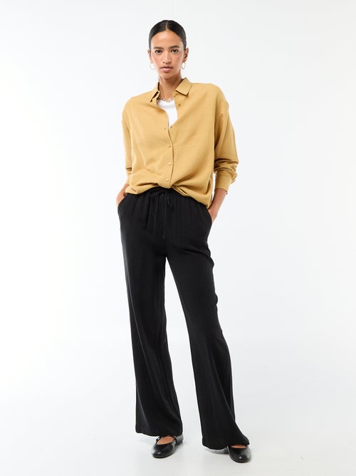 Pantalon léger femme à coupe large avec taille élastiquée - Kiabi Pantalon léger femme à coupe large avec taille élastiquée - Kiabi