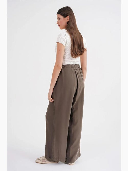 Pantalon palazzo plissé taille haute avec cordon de serrage mixray - Kiabi Pantalon palazzo plissé taille haute avec cordon de serrage mixray - Kiabi