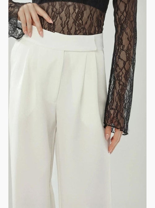 Pantalon palazzo taille haute à jambes larges hiccup - Kiabi Pantalon palazzo taille haute à jambes larges hiccup - Kiabi