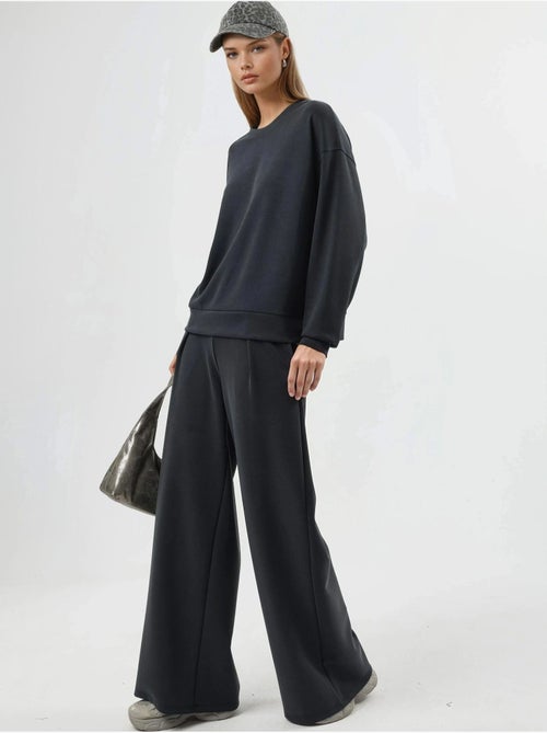 Pantalon palazzo taille haute avec élastique busem - Kiabi Pantalon palazzo taille haute avec élastique busem - Kiabi