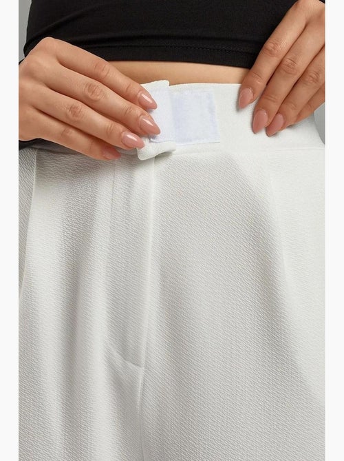 Pantalon palazzo taille haute en crêpe élastique hiccup - Kiabi Pantalon palazzo taille haute en crêpe élastique hiccup - Kiabi