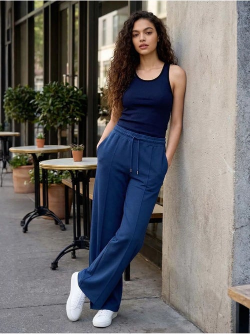 Pantalon palazzo texturé à jambes larges avec cordon de serrage à la taille tommy - Kiabi Pantalon palazzo texturé à jambes larges avec cordon de serrage à la taille tommy - Kiabi