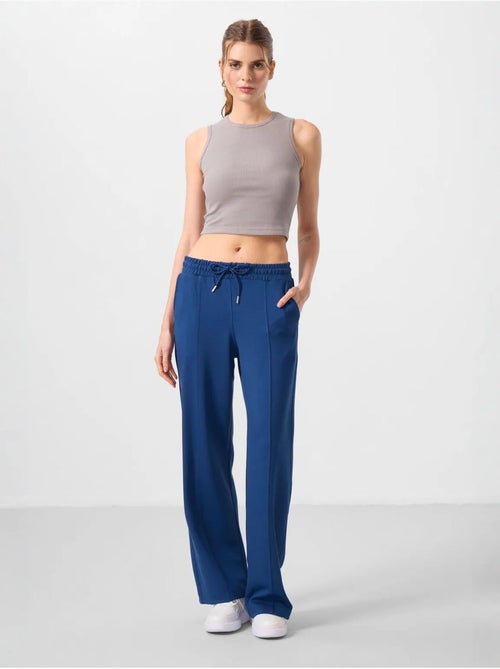 Pantalon palazzo texturé à jambes larges avec cordon de serrage à la taille tommy - Kiabi Pantalon palazzo texturé à jambes larges avec cordon de serrage à la taille tommy - Kiabi