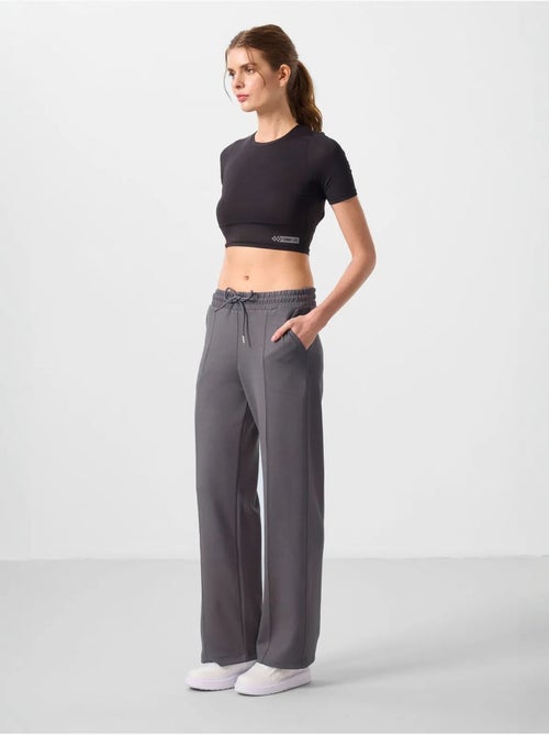 Pantalon palazzo texturé à jambes larges avec cordon de serrage à la taille tommy - Kiabi Pantalon palazzo texturé à jambes larges avec cordon de serrage à la taille tommy - Kiabi