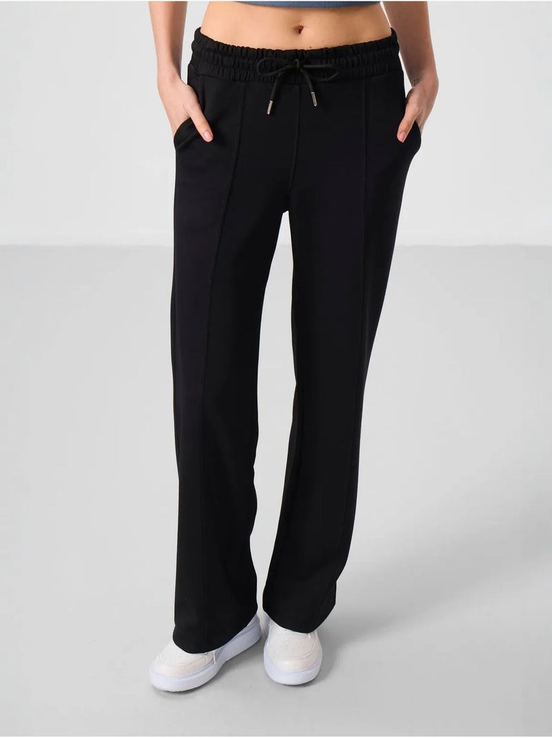 Pantalon palazzo texturé à jambes larges avec cordon de serrage à la taille tommy Noir - Kiabi