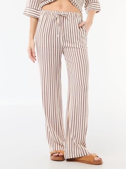 Pantalon pour femme en toile légère à coupe large et taille élastiquée - Kiabi Pantalon pour femme en toile légère à coupe large et taille élastiquée - Kiabi