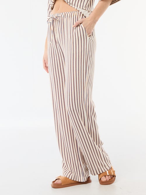 Pantalon pour femme en toile légère à coupe large et taille élastiquée - Kiabi Pantalon pour femme en toile légère à coupe large et taille élastiquée - Kiabi