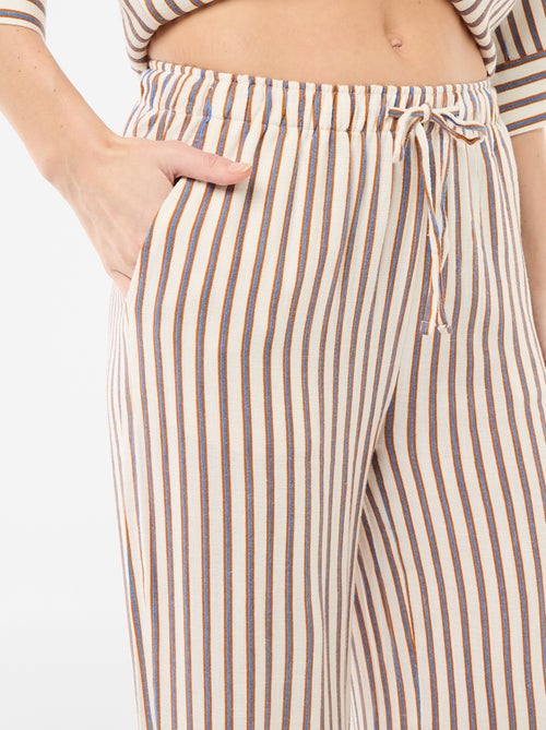Pantalon pour femme en toile légère à coupe large et taille élastiquée - Kiabi Pantalon pour femme en toile légère à coupe large et taille élastiquée - Kiabi