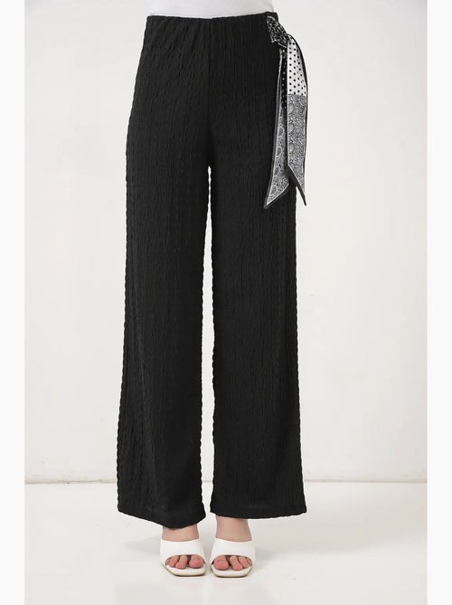 Pantalon taille haute à jambes larges avec détail de nœud bdart - Kiabi Pantalon taille haute à jambes larges avec détail de nœud bdart - Kiabi