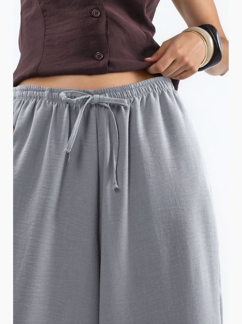 Pantalon tissé à jambe large avec taille à cordon de serrage busem - Kiabi