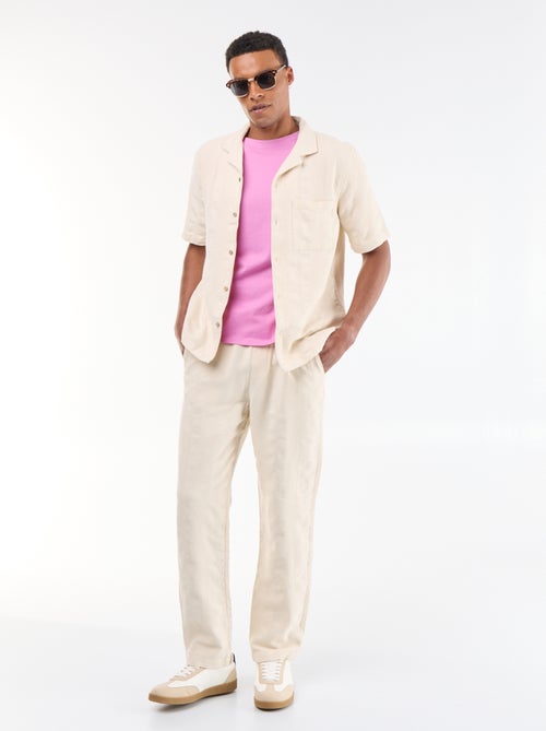 Pantalon uni en matière texturée - Kiabi
