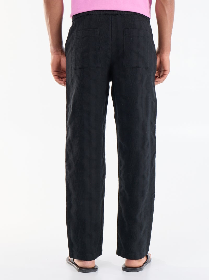 Pantalon uni en matière texturée Noir - Kiabi