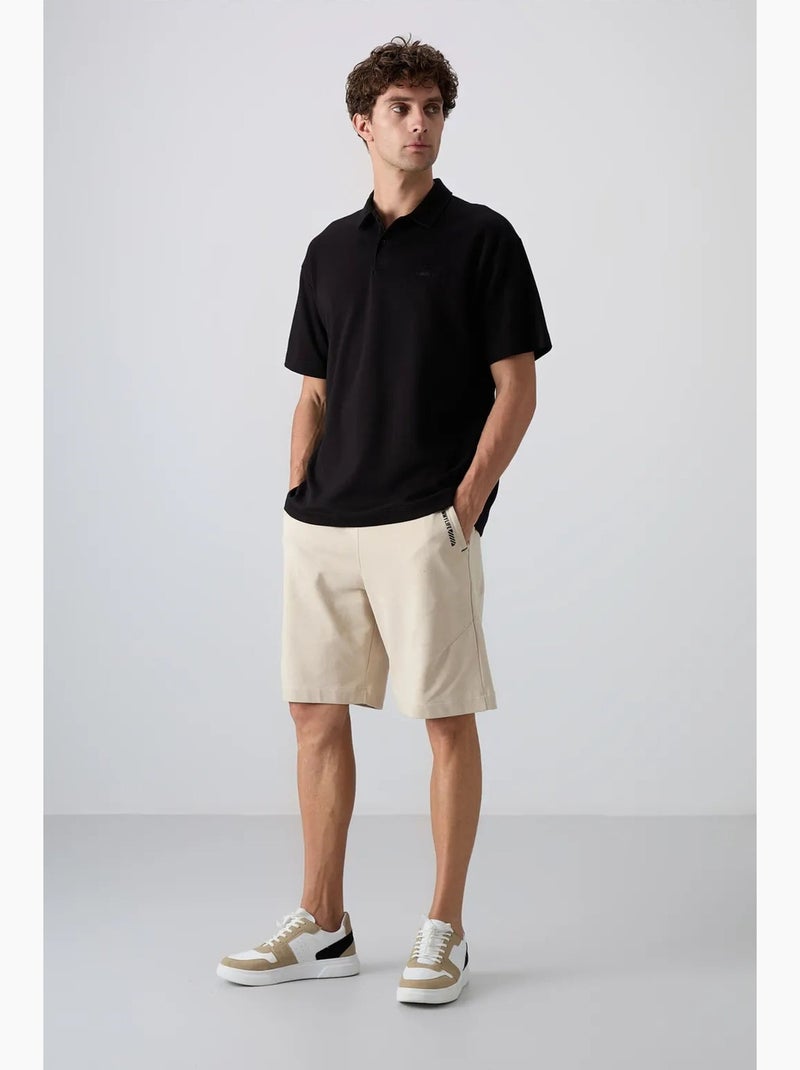 Polo ample tommy Noir - Kiabi