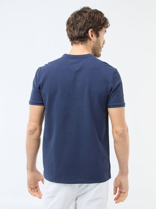 Polo en maille piquée homme à col tunisien uni - Kiabi Polo en maille piquée homme à col tunisien uni - Kiabi