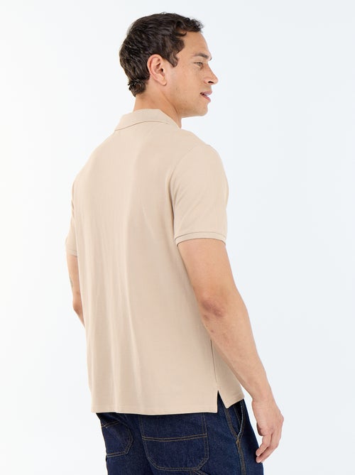 Polo en maille piquée uni Homme à manches courtes - Kiabi Polo en maille piquée uni Homme à manches courtes - Kiabi