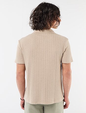 Polo en matière fantaisie ajourée