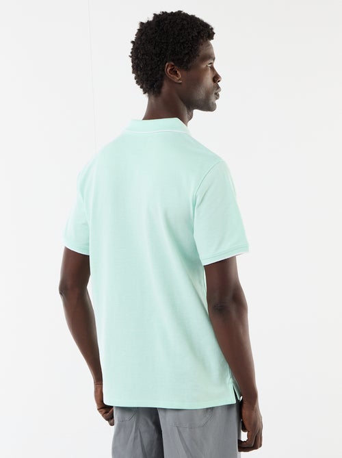 Polo homme en coton avec broderie tropicale - Kiabi Polo homme en coton avec broderie tropicale - Kiabi