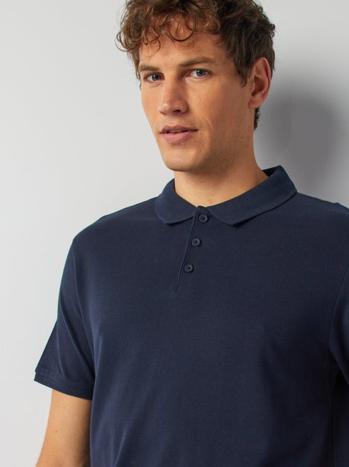Polo homme en coton biologique à manches courtes uni - Kiabi Polo homme en coton biologique à manches courtes uni - Kiabi